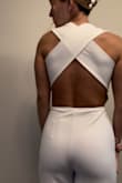 I love this piece! It's not see-through. Pretty nice material, kind of thick but soft and stretchy. The pants are a little long so I did have to get it hemmed. The waist area can bunch up on the sides but if you pull it down it goes away! The back is adorable and the straps are wicked comfortable. I'm usually a medium I ordered a small cause I know they run buoy and it fit perfectly! - Jolane T.