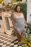 The quality of the material is amazing. The dress is stunning! It is a little heavy but very well made. I received so many compliments! If you're looking for a tight fit then definitely order your true size. - SHARON B.