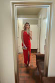 I am obsessed with this red dress! I wish they made more dresses in this color. Such a beautiful, bright, true red. I felt so sleek and beautiful in it. It fits like a glove thanks to the stretch. The material is so thick and good. I got many compliments on it. I wore almost 4-inch heels (I think). I only had the slit hemmed because it was for work. The length was perfect! - Karina L.