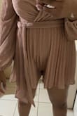 This romper's quality and color are perfect, however, it's not for tall women with long torsos, the fit was horrible and disappointing, I couldn't wear it. I made this purchase using the guideline of the model height. I was wrong. So now I'm in the process of going to a seamstress to convert to a short dress. I'm in the Caribbean therefore returning wasn't an option for me. - Adanna R.