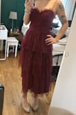 The dress fits perfectly true to size. The tulle isn't scratchy at all. It makes you feel like a princess. :) - Kelly B.