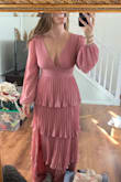 This dress is very cute! The ruffles are super flattering (coming from a freshly postpartum body ;) ) my only disappointment is the color looks much more bright and like a Barbie pink in the pic. I'd say it's true to its name "dusty pink". Overall, happy! - Olivia K.