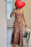 What a stunning and unique dress. It's gorgeous. Unfortunately, it was too tight in my chest. I'm not big-chested either. - Laura D.