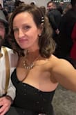 I wore this on New Year's Eve. I'm usually a true medium and this was a tad snug but I made it work.  A lot of the rhinestones fell off, just from simply trying it on, which was disappointing. But there were enough that you couldn't really tell, except they were all over my floor.  It was very long and I had to hold it up while walking which could be fixed by hemming. - Kelly H.