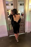 This dress was perfect for a winter wedding. I sized up to a large because I didn't want it super tight and it was perfect. It was still form fitting but I didn't feel like I was being sucked into it. It stayed in place all night and didn't have to pull at the sleeves at all. - Natalie G.