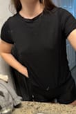 This top is super soft and loose in width. I'm 5'9, so it's a bit short (not uncomfortable but not as loose as pictured). Probably could've gotten a large for length, but I still like it a lot. - Kaitlyn W.