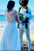 I ordered several dresses from Lulus to try on for my beach elopement in Maui. This was the first one I tried on and I knew it was the one! Very lightweight, simple, and beautiful. The back lace is so beautiful and simple, and the buttons give it a classic touch. Loved it! - Gabrielle C.