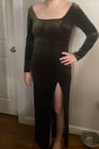 I bought this as a bridesmaid dress. It shipped very quickly! While not necessarily the style I would choose for myself, the dress was a nice, heavy fabric. It was very soft and warm! The slit was pretty high, at my upper thigh so I will have that altered. The shoulders have a thin strip of grip-like material sewn in to help keep them from falling down. I am 4 months postpartum and the material felt stretchy but clingy, so not the most forgiving in the stomach area. I would recommend wearing shapewear with it. The dress was just barely long enough for me (5'10) so I could only wear a low heel. The sleeve length was perfect. You will likely need to steam it before wearing. Overall, I felt that this was a nice dress that can be worn again for other occasions! - Katie C.