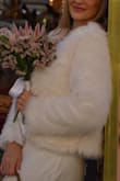 I wore this faux fur jacket for my elopement in Italy during late November. It was just right for cooler temps with my wedding dress, but I also paired it with jeans later that evening for dinner. Very versatile. Obviously, it's not going to look like real fur, but it doesn't look like cheaply made/material. - Nina S.