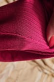 I liked the color and style, but [when I tried it on and while I was wearing it for the first time on vacation, I didn't realize it had two small holes in it]. One was near the seam on the side, the other on the thigh. - Erin I.