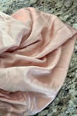 It feels cheap. It's all wrinkled up, and in this fabric, you can see your underwear. The color is not ivory champagne; it's blush pink. - Kasey M.