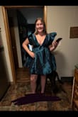 This dress is amazing! Very pretty color and a perfect length. My mom even loved it! I did have to iron the dress (wasn't ironed in the picture) after I had tried it on because of the lines from the folding in the packaging. The dress fits PERFECT and makes me look pretty small at the waist. What I love most about the dress is the neckline and the back of the dress; the fact that the shoulders have a rubber strip on the inside so the sleeves stay in place made this dress even more perfect for me! Overall, this dress is wonderful, and I would totally recommend! - Ariel V.