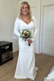 I wore this dress for my courthouse wedding and loved it. My only issue was the sleeves were cut a little weirdly. I would have had them altered if I had time but I was able to make it work, and the slip liner underneath would wrinkle and you could see it if you weren't paying attention and pulling it straight. Overall I was happy with my purchase. - Jessica S.