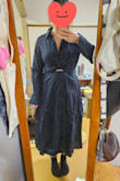 I guess I imagined it a little different than what it turned out. It's made from a rougher fabric than I thought, very thick and wrinkles easily. Lays on my body frumpy. It has a super deep neckline, but the rest of it looks very much like a work outfit or a detective jacket. I'm not sure how to wear it. There's no zipper or elastic band. - Michelle M.