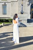 I wore this dress for my wedding at City Hall, which was during the winter, and it was perfect. I felt very pretty in it. It's long so, even with heels, I ended up stepping on the hem of the dress a few times. The quality is very good for the value, and it is a type of dress that does not mark the body, which was great. Very fluid and the fit is perfect - Aline P.