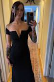 This dress is beautiful! I received so many compliments. The XS fits perfectly, overall. The arms are a little snug but not uncomfortable. Would pair it with a higher heel, 4 inches, to avoid dragging! - Skylar H.
