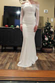 The overall fit of this dress isn't too bad, but the fabric will definitely show underwear lines and kind of rolls up. The sleeves were a disappointment and didn't lay right. - Jessa S.