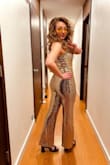 Such a FUN jumpsuit. I bought this for my birthday party. We went to a decades themed club. I kid you not, I had SO MANY people stop me to compliment my outfit. I did have to hem the pants by about 5 inches and wore 1 1/2 inch platforms with it. I also had to take out 10 links from the straps with pliers as there was no other way to adjust them. The belt is separate. I purchased it at a big name grocery/everything store that starts with the letter T. - Emily H.