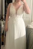 I love this dress! I didn't expect to love it, but it fit me very well. The sequins are not overpowering which I love, the lace isn't scratchy, and the bodice is more sheer than the photo shows. I will be taking the white cups out for a better overall look but you could always keep them in. The cut of the back also covers some baby back rolls which makes me feel good! I absolutely love this for my elopement. - Jenny D.