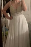 I loved this dress! I ordered the medium because I am typically a size 8 and realized that it was about 2 in too small. The bust is so beaded there is no room for stretch. AKA, if you sometimes were a size larger, get the size larger! I got the size larger and it fit snuggly! The only reason I returned it was that the straps would have had to be hemmed up and I needed the bottom hemmed so alterations would have been more than the dress haha. Truly a beautiful dress! - Jenny D.
