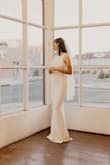 The dress was such good quality, and the material was super thick! I'm not super tall but not short either, and the dress was the perfect length, if not a little bit long even with heels! It was simple, but the back made it still feel fancy and pretty. My wedding was 4 months ago, and I still love my choice! - Hailey G.