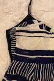 Ordered a small (I am a small across the board), and I felt like I needed to go up to a large. The inseam and rise are very short, and I couldn't get the bodice [to] zip up all the way. I compared this to a dress I bought from Lulus last spring in the same size (small) with a similar shape, and this was 2" smaller across. Whoever sized this was waaayy off - Emily K.