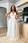 This dress was very pretty but not the one I chose. It did not hit my waist in the right spot but is still very elegant and a great material! Loved the bow in the back as well! - Felicia E.