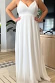 This dress in the back is gorgeous but did not do anything for me in the front, personally. A bit bland. - Felicia E.