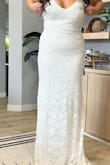 This dress is pretty but didn't fit my body right and the straps were so long. It's definitely form-fitting but the back is very pretty with the ruching around the bottom. - Felicia E.