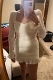 I ordered a small at first and it was too tight around the legs. The whole dress is stretchy except for the band of lace at the bottom and the waist. I'm usually a small in Lulu's dresses but it was just too tight and short. The picture is the medium and it fits perfectly and there is even a little room in the waist. - Samantha H.