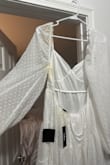 I definitely got someone's stained, used, dirty return. I absolutely loved the dress and before I tried it on I saw gross yellow pit stains and what looks like makeup on the sleeve and more yellow down the back. So nasty :( - Olivia R.