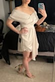 Honestly, I ordered this one as a gamble, thinking I'd probably hate it on me and end up returning. Turns out, I absolutely adore it, and this is going to be my wedding reception dress! It's super comfy, and on someone my height, the length of the shorter side hits just right (not too risqué). It's flattering without any need for shapewear or sucking in.   
Worth noting: I selected "a little loose" for the fit not because it was loose on me, but because the waist might be too loose on someone with a 26-27 waist, as indicated on the guide for a size small. I ordered the small expecting it to be a bit too tight on my 28" waist, but it actually fits me perfectly and comfortably (so much for my plan to use it as weight loss motivation hehe). - Jen H.