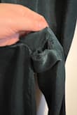 I am so disappointed in this jumpsuit. I purchased it for a work holiday party, and after one wear, there are holes in both sleeves and along one of the legs. The material is extremely thin and cheap, and the fraying is so bad that I'm not sure it can be repaired, making it unwearable. The material also attracts a ton of static - when I put it on, the material clung to my legs in a super unflattering way. Save your money, as you can honestly get something from Amazon for a fraction of the cost that's more solidly made than this jumpsuit. - Sarah G.