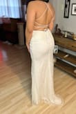 I have slight back rolls so it didn't feel flattering on my back. Otherwise, it's a gorgeous dress. The material is great quality. I will look for a similar dress with the same neckline but a different back. For sizing, I'm usually a size 6-8 in pants because I have wide hips and a big booty. The dress fit like a glove in my opinion. Giving it 5 stars still because the back rolls are my issue, not the dress! - Diana C.