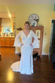 I ordered this dress along with 2 others. I am getting married in September and this is a perfect outdoor/fally wedding dress! It hugs my curves very well and the lace seems to hide my loose skin from weight loss nicely. I will have the tan slip sewn to the dress but that is a small fix. For the price and material it is a great purchase. The V-neck is very flattering as well. - Hannah D.