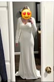 The dress was perfect for our simple winter wedding. The material was thick, and of nice quality. It was fully lined. I did add bra cups to help camouflage my nipples and wore shapewear to keep from having a panty line. I had to have the front altered a few inches even with 3-inch heels. I loved this dress and felt amazing in it. - Natalie K.