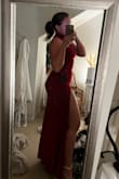 I think this dress is really pretty. The deep red is a beautiful color and the slit is a nice piece to the dress. I have a shorter torso so the neck piece didn't look as good on me. Otherwise, I'd suggest this dress! - Jordyn M.