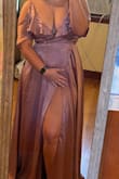Showed way too much boobs for me, and the button wouldn't clip to cover up. The slit wasn't able to cover high enough to feel like I would flash someone - Laura P.
