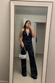 Love this jumpsuit! Needed it for a disco night in Nashville, and everyone, even my fiancé, loved it! I got a medium, and it felt true to size. I do have a small chest so I did need to get that hemmed. I'm also 5'3, and it did feel pretty long, even with heels. But I got that hemmed too. I need this in a white color for my bachelorette - Jenifer C.