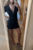 Great material! A structured material that is flattering and comfortable. The design on the neckline does not rub or irritate the skin. The dress is pretty short on me, but that frequently is the case for shorter-style dresses. - Ashley S.