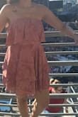 I wore it to the eras tour. It is a pretty pink. There is a non-slip silicone grip on the inside that keeps the dress from slipping down. Check the length if you're a tall girl. It was perfect for me. The material is not the most comfortable in summer since it's not too absorbent. - Abhinaya R.