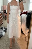 I can't wait to wear this to my spring bridal shower. It is slightly see-through, but nothing a slip skirt underneath can't fix. it looks just as pictured! The top part is a little large for me, so I may have it altered to fit more snug to my chest as it does gap pretty decently. I ordered a small and it was definitely true to size. I am 5"3, 130 pounds and 32B. - Nicole D.