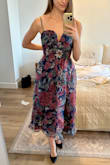 I bought this dress because I saw that it looked good on a small chested model. It can be hard to find flattering dresses that I can fill out. I'm pretty boxy and straight in shape so I followed the measurements and got a small. It either needs to be altered or I need to exchange for an xs. It runs a bit big. There is lots of room in the sides and front.
Besides that, I'm really excited to wear this dress because it is unique and different! It's great quality and I'm very pleased with the fabric. Looks exactly like the photos. - Emily