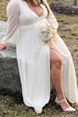I was so in love when I found the dress I wanted. I even used the app to see what size I should get for my height and weight, which recommended I get a large. Unfortunately, when I got it, it was so long. I had to get it altered. From my chest, I also tried to get it fixed, but the lady could only cut so much... sadly, my photos came out with my bra showing. I had to hold the front part the whole time, and I was stressed over this. The photographer kept trying to fix it, and in the end, it kept coming down. If you have a bigger chest, please do not buy this... you will stress... - Devora A.