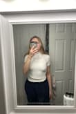 I sized down to an XS (pictured), as the S sat strangely on me (rippled at the torso). The shirt is very comfortable itself but extremely see-through, regardless of lighting. Everything underneath is visible. I will be returning, which is unfortunate- I loved the fit and feel, but it's just not wearable for me. - Nina L.