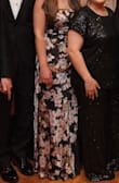 The dress was beautiful, and it was nice that it was lined since it's a thin material. It fits snug in the waist but a tad loose in the bust. If you have a small bust, it may not be a good fit for you. - Christine D.