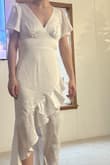 I bought this on a whim because I'm usually scared about buying off websites I've never bought before not knowing how their sizing runs. IT IS BEAUTIFUL and of great quality. I have stomach tattoos and you can't even see them through the fabric up close. A little steaming would make this perfect. 10/10 would recommend! I am just about 5'4 and it was a little long but nothing a nice pair of heels wouldn't fix! - Meredith M.