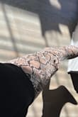 I was looking for a snake print boot and these are cute. They look just like the picture and the calf size is just right. They are comfortable to wear all day. I got them on sale which was nice, too. They are a bit challenging to get off and on, but I just allow myself extra time and get ready to sweat. They do not have a zipper, but there is a tiny bit of hidden stretchy material in the ankle area. I roll down the top while putting them on which creates a handle for me to grab them and pull them up better. I ordered my usual size 11 and they feel great. I have a muscular calf and these fit me just right, I usually only buy wide calf boots. They might be too wide for someone with thinner calves unless you like an oversized calf look which is trending. I am 5'10" and they come up pretty high on me; right under my knee. I would buy them again in multiple colors. - Danielle C.