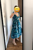 Very pretty color and pattern, looks just like the picture! I usually always a size 4 on top, size 6 in pants. The waist on this dress for size small was very tight on me. I usually wear a 32-34DD bra for reference. I needed someone to help zip me up and tie the shoulders. Once I got it on I was happy with the fit, though it is still a tad uncomfortable in the waist I plan to keep it anyway as I think a medium would be too large on me. At 5'2" the dress hits mid calf. Even though it's not in a petite size it still fits well since I can tie the straps as tight as I need to get the right fit in the shoulders. I could see if you have a much larger or smaller chest you might have some underboobage issues, but I feel pretty secure, the pattern and lining conceal nipples pretty well. The dress came folded up in a small square, so I think it's perfect for traveling to a wedding as it didn't really show any wrinkles after coming out of the small bag. - Sara D.