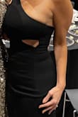 I ordered this for a gala. I wanted to stick with conservative black but with a little wow factor. This one was perfect. Fits like a glove. Super sexy. Material was thick so no need for a bra. The slit in the dress was really high and almost showed my underwear. I had it altered bc it was obscene, but that was the only issue. Be aware that the location of the cutout on the left is tricky to keep your boob from showing. Probably works better on a smaller chest or very perky boobs. I loved it and would definitely recommend. - Morgan S.